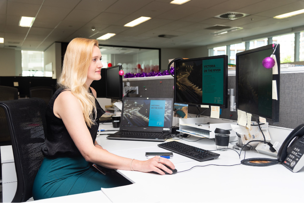 AECOM Graduate Sarah Jane Fausset at her desk