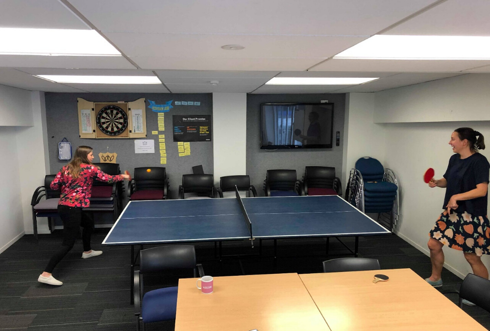 Anna playing table tennis with colleague