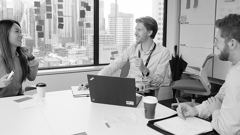 DXC employees in a meeting