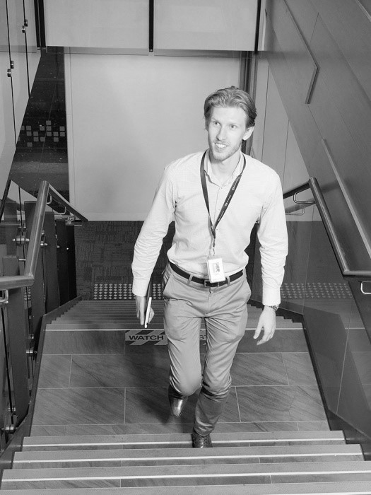 DXC graduate walking upstairs