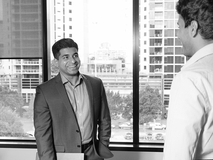 Jithin Xavier DXC Graduate with a colleague