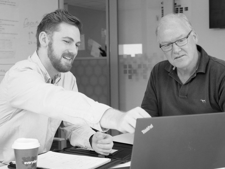 Patrick Stoddart DXC Graduate with a senior colleague