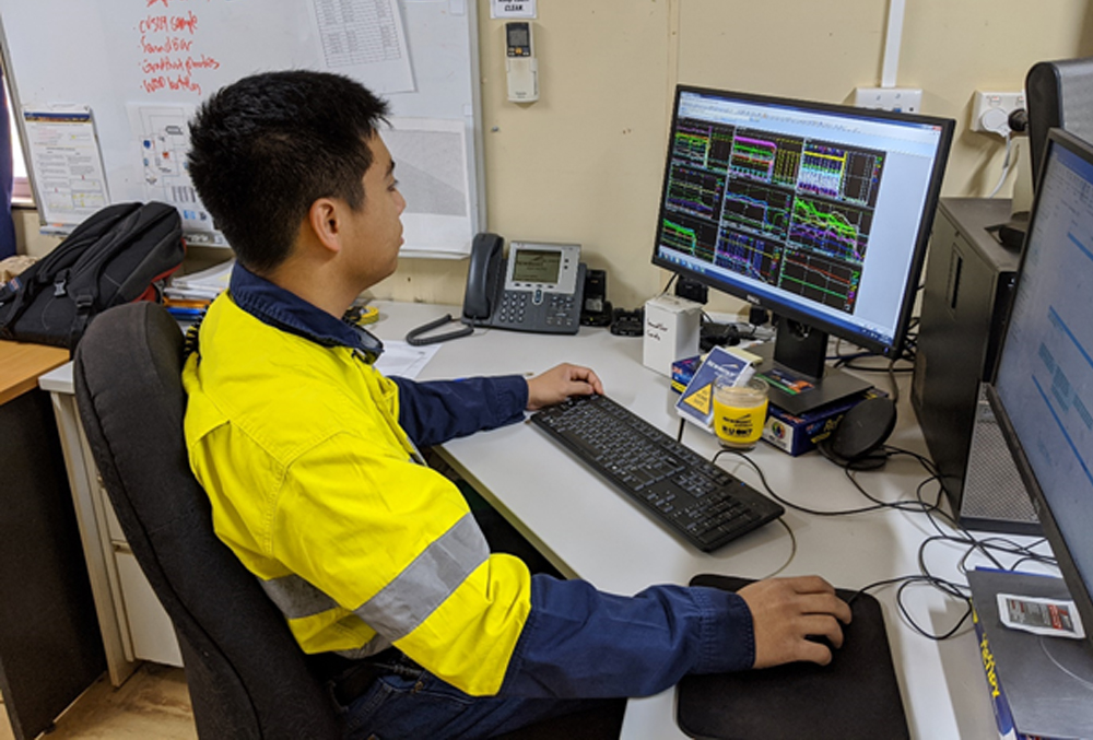 Newmont Goldcorp graduate Lawrence Alago checking emails