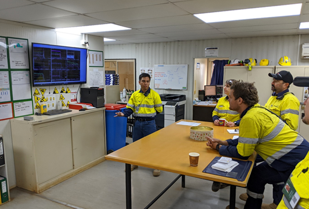 Newmont Goldcorp graduate Lawrence Alago in a meeting