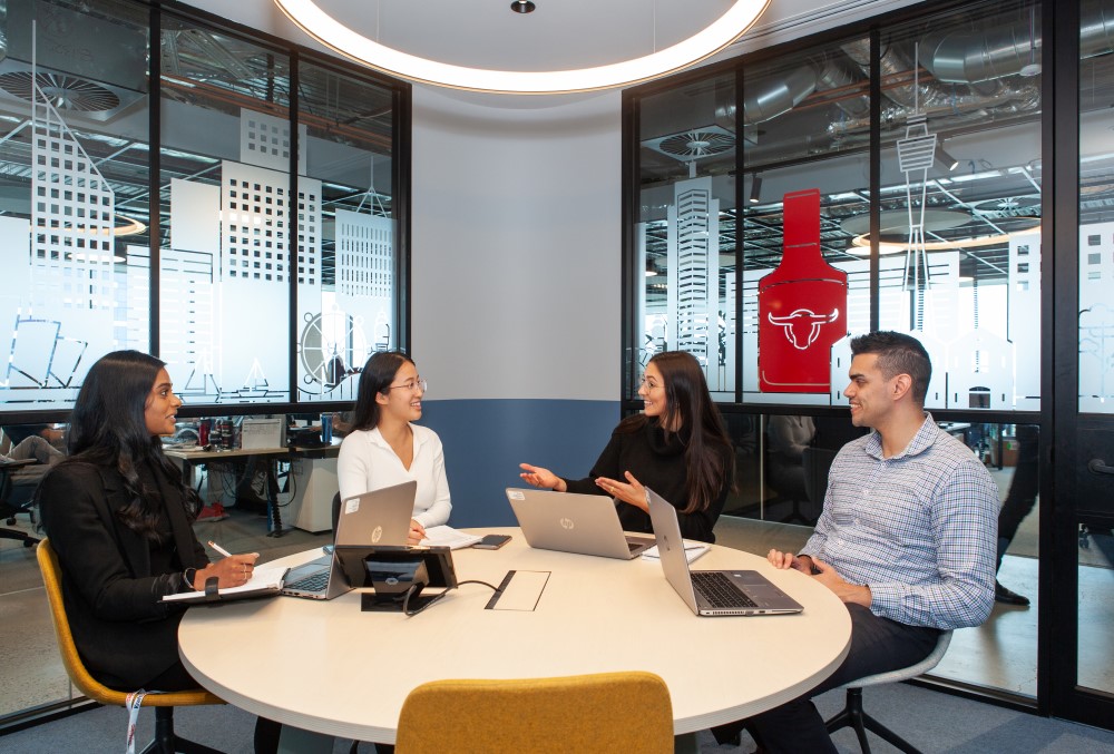 Kraft Heinz Graduate- Group of young professionals having their business meeting.
