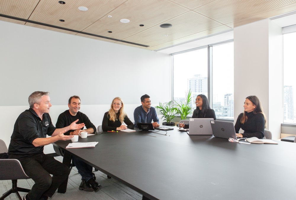 Kraft Heinz Graduate- Company employees conducting a meeting.
