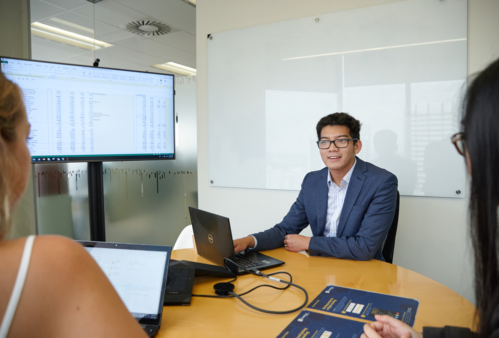 Stockland graduate Khang Hoang in a team meeting