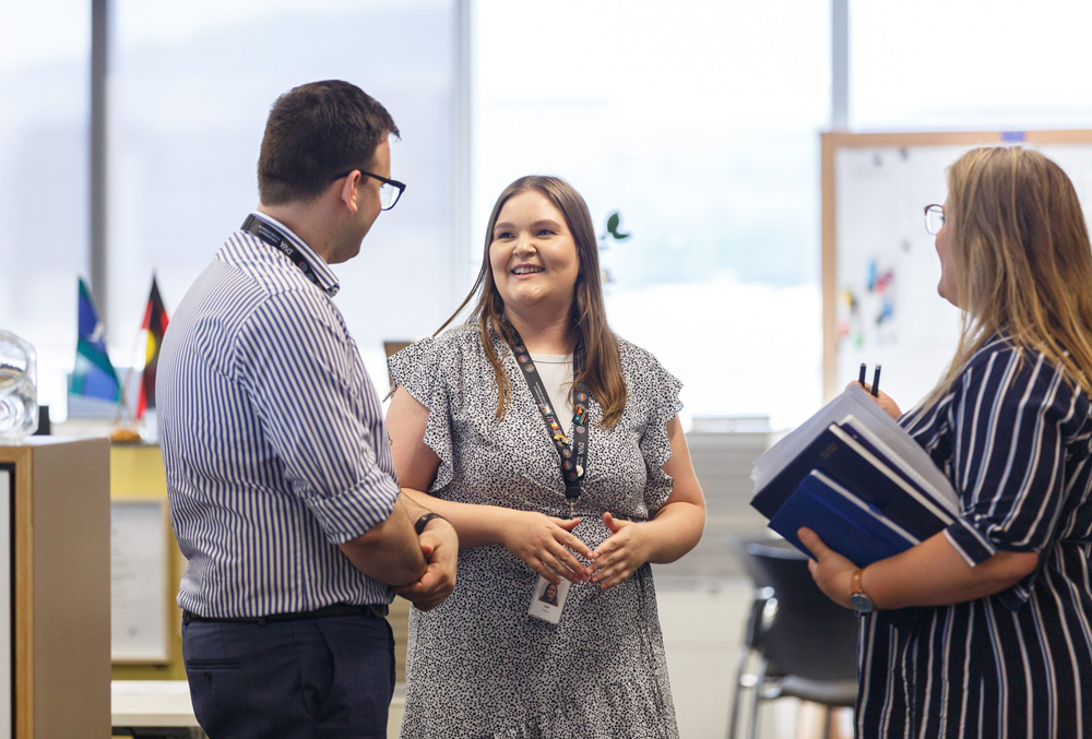 DVA graduate Amy Joslyn discussing with colleagues