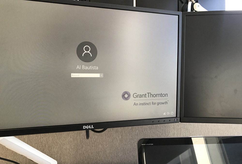 Grant Thornton Graduate Al Bautista logging in the computer