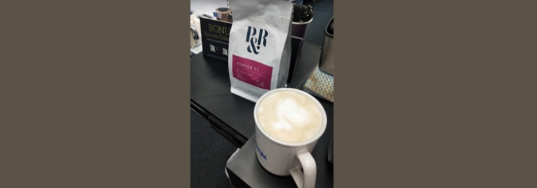 coffee at desk to start Keeley O's day at work