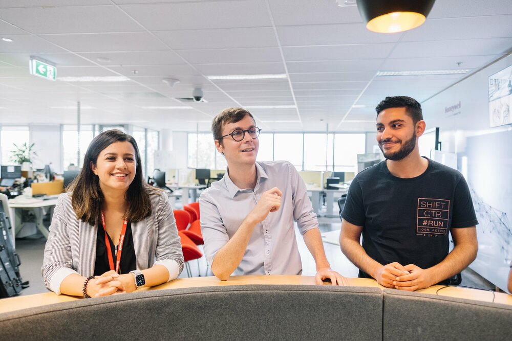 Young professionals in a stand-up meeting
