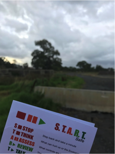 checking the S.T.A.R.T card overlooking a field