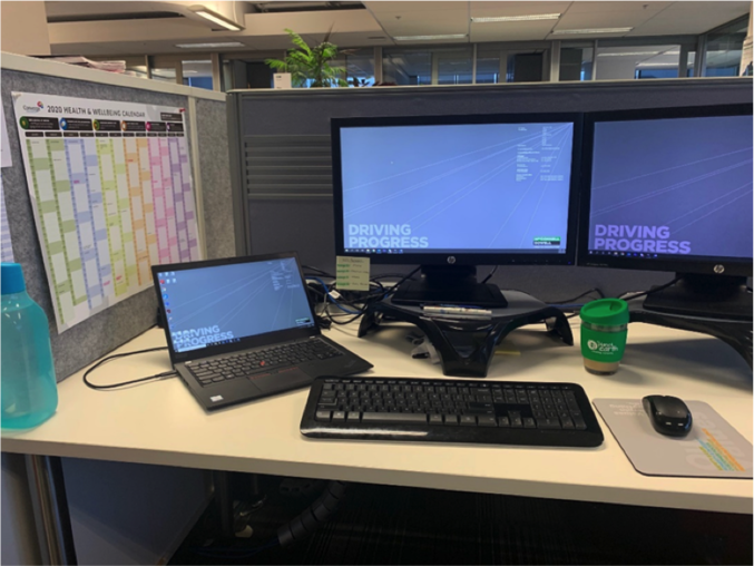 McConnell Dowell Sarah office desk with a PC and laptop