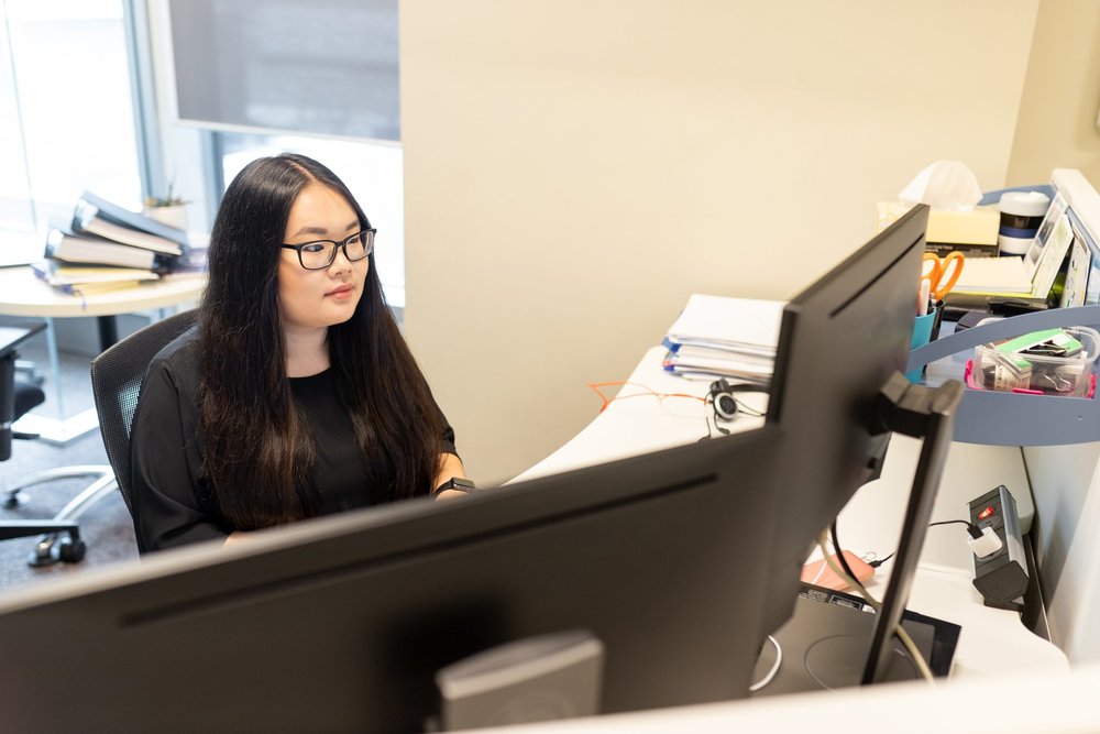 A young professional at her office desk