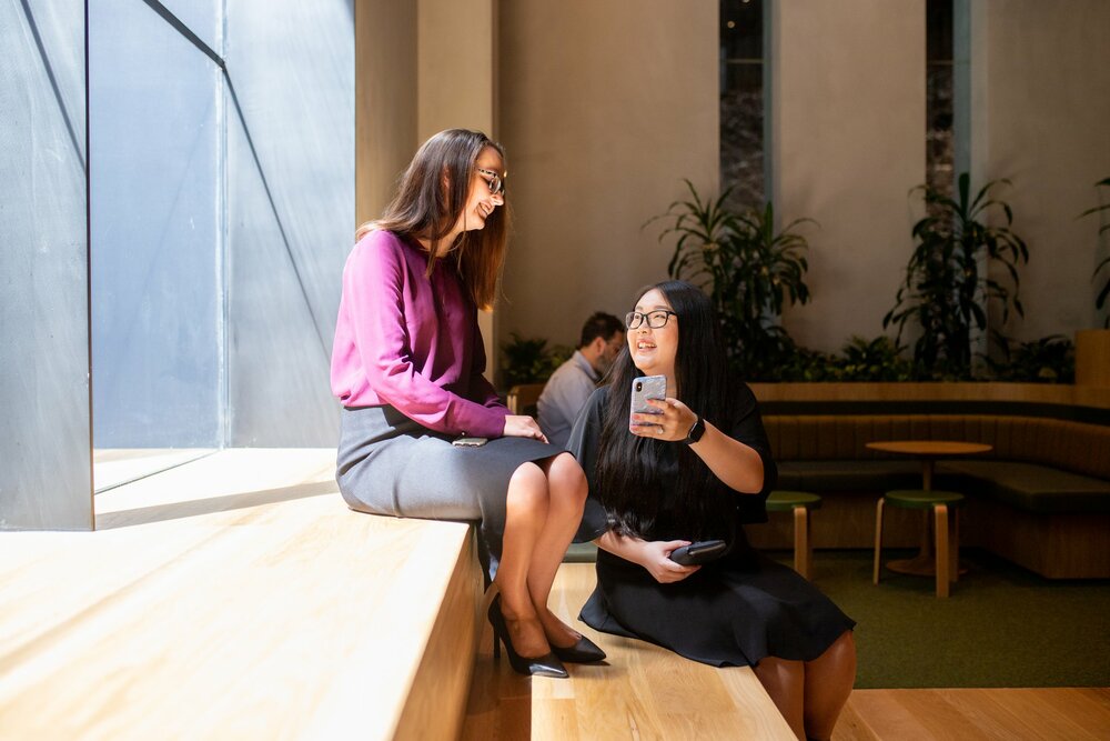 Two young professionals having coffee
