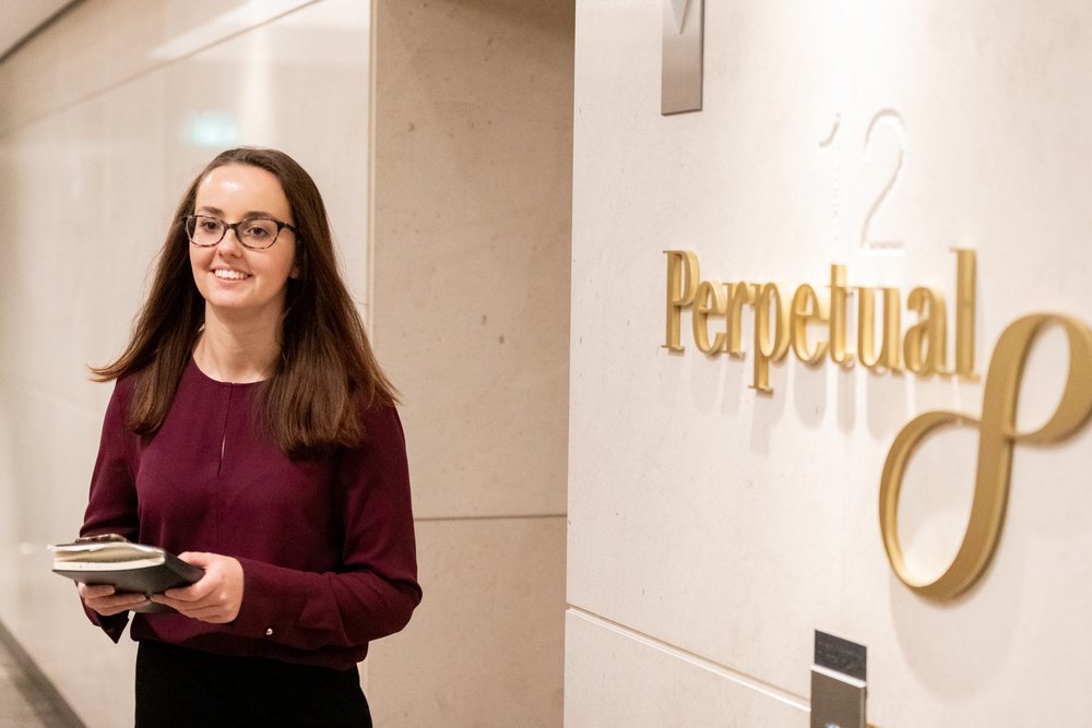 A young professional walking at the lobby