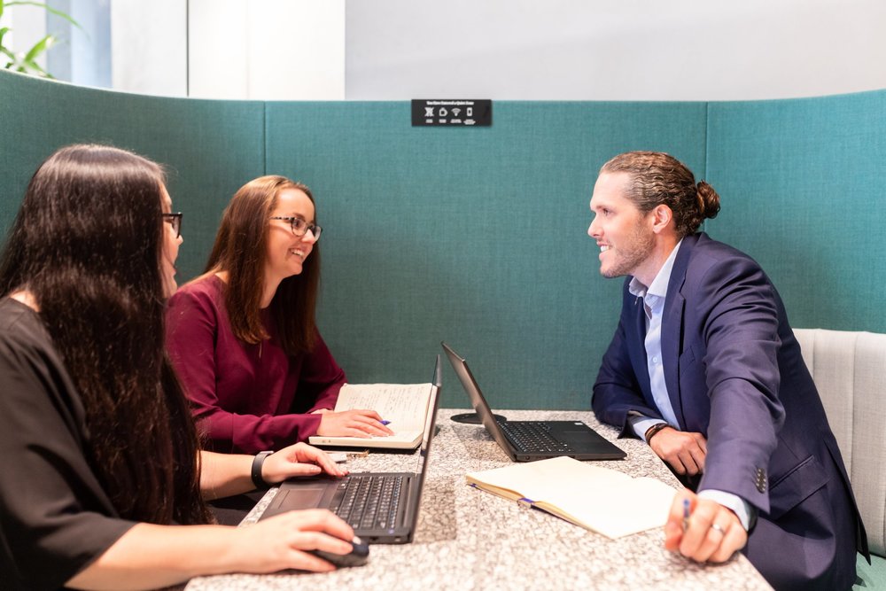Three professionals on a meeting