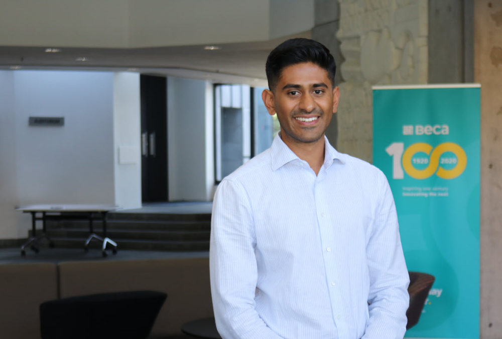 Beca Graduate- Young male engineer standing in the office.