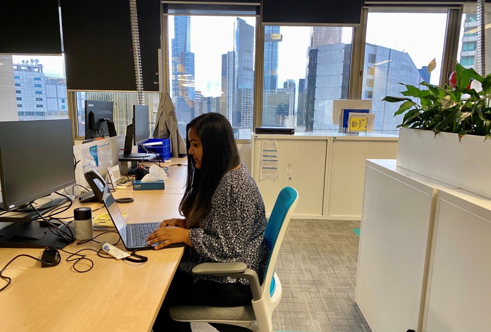 Capgemini Australia Graduate - Young female professional working on her laptop computer.