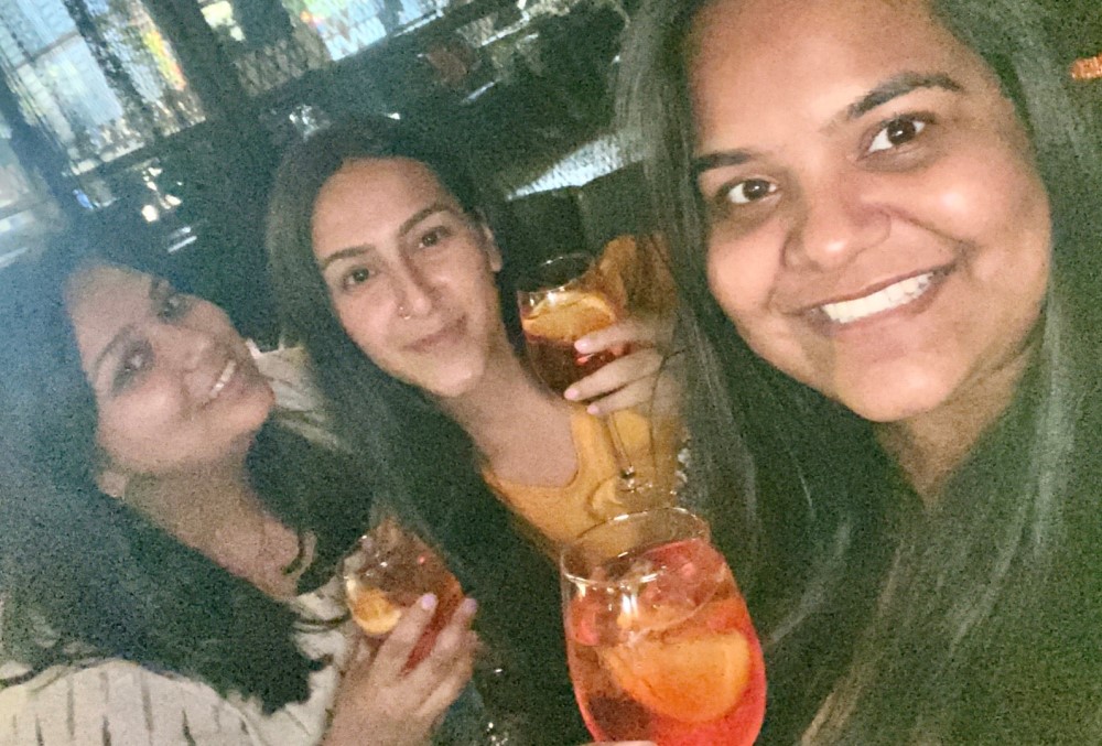 Capgemini Australia Graduate - Young female professionals holding drinks.