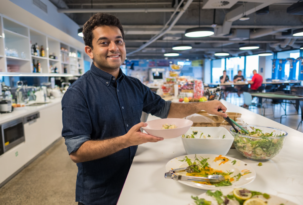IMC Graduate- Male professional serving food on his plate.