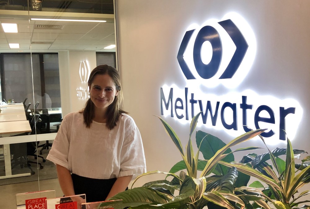 Meltwater Graduate - Young female professional standing on the reception area