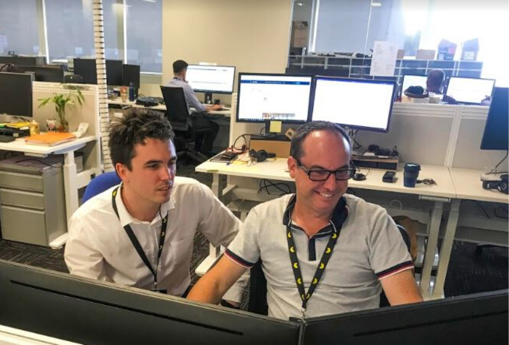 RAA Graduate Ryan Carmody code with a senior developer